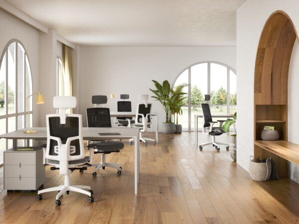 An office with a wooden floor with white Skill office armchairs next to white desks, Stage 1
